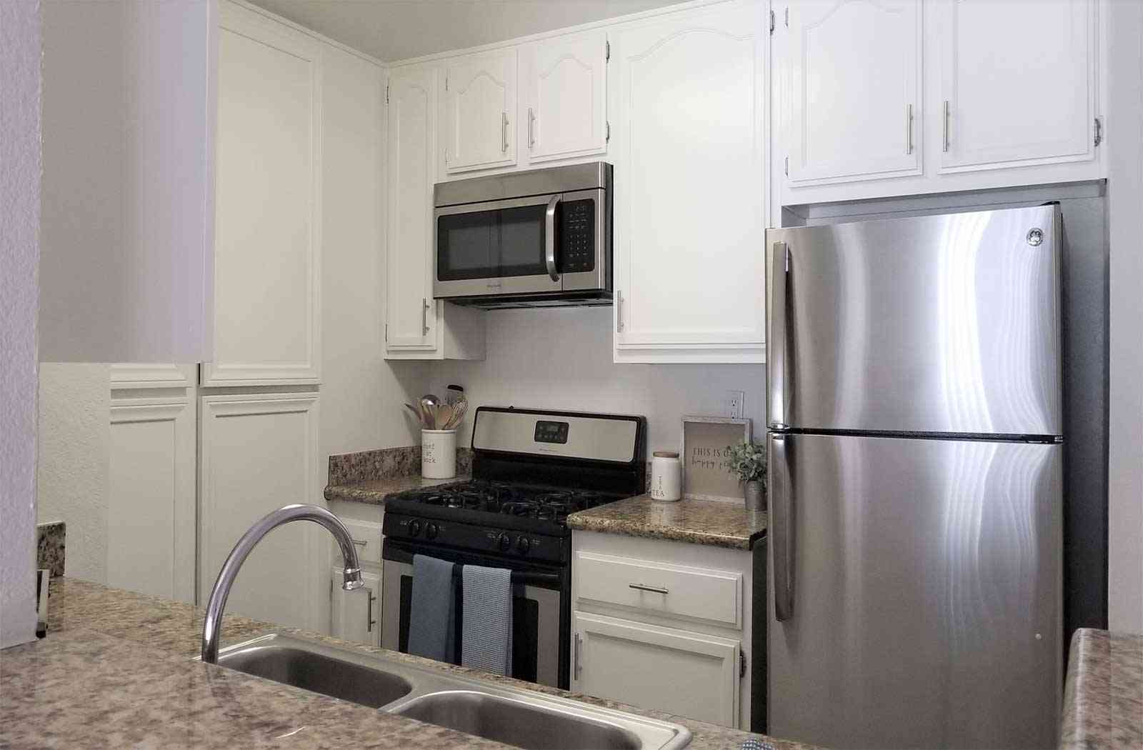 granite countertops and white shaker cabinets