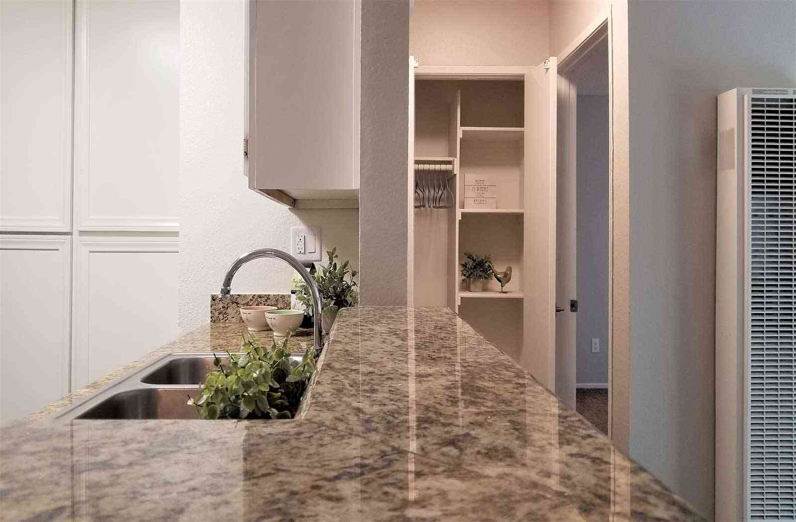 granite breakfast bar with closet view